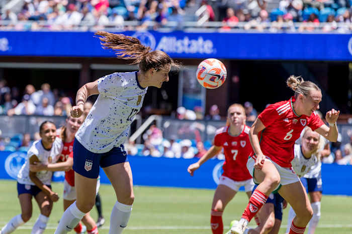 Jul 9, 2023; San Jose, California, USA; United States of America midfielder Andi Sullivan (17) heads the ball as Wales midfielder Josie Green (6) defends during the first half at PayPal Park. Mandatory Credit: John Hefti-USA TODAY Sports
